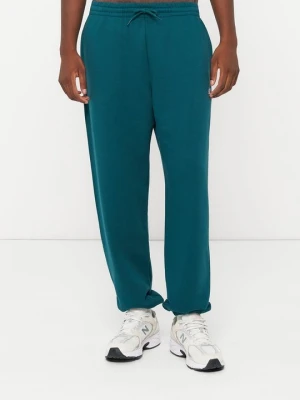 Spodnie dresowe New Balance zielony