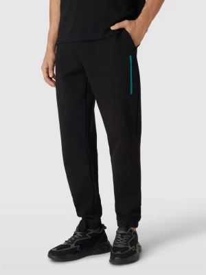 Spodnie dresowe o kroju comfort fit w jednolitym kolorze CK Calvin Klein
