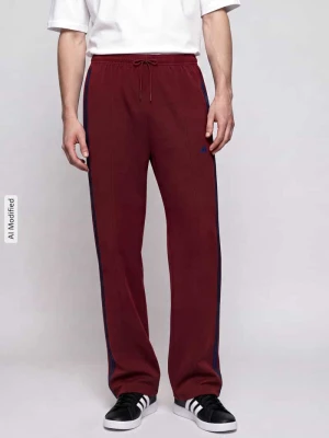 Spodnie dresowe o kroju loose fit z domieszką bawełny model 'STADIUM' Adidas Ciemnoczerwony