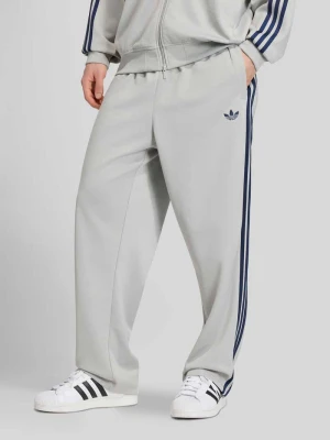Spodnie dresowe o kroju loose fit z mieszanki bawełny adidas Originals