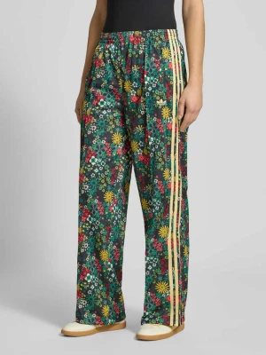 Spodnie dresowe o kroju loose fit z wzorem na całej powierzchni adidas Originals