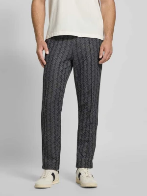 Spodnie dresowe o kroju regular fit z dodatkiem bawełny Lacoste