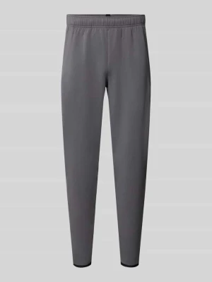 Spodnie dresowe o kroju regular fit z dodatkiem bawełny model 'Unstoppable' Under Armour Antracytowy
