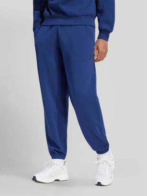 Spodnie dresowe o kroju regular fit z dodatkiem modalu Adidas Granatowy