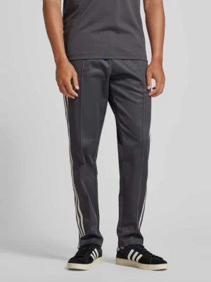 Spodnie dresowe o kroju regular fit z elastycznym pasem model ‘DFB’ adidas Originals