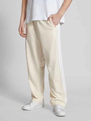 Spodnie dresowe o kroju regular fit z elastycznym pasem model ‘FIREBIRD’ adidas Originals