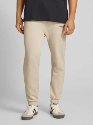 Spodnie dresowe o kroju regular fit z elastycznym pasem model ‘KANE’ jack & jones