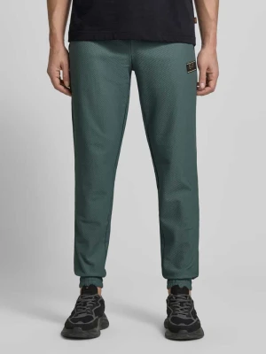 Spodnie dresowe o kroju regular fit z fakturowanym wzorem EA7 Emporio Armani