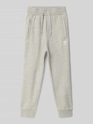 Spodnie dresowe o kroju regular fit z mieszanki bawełny adidas Originals