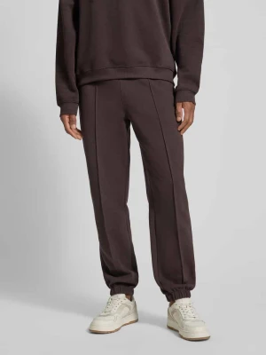 Spodnie dresowe o kroju regular fit z mieszanki bawełny Lacoste