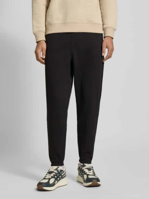 Spodnie dresowe o kroju regular fit z mieszanki bawełny Tommy Jeans