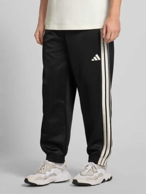 Spodnie dresowe o kroju regular fit z nadrukiem logo model ‘Stadium’ ADIDAS SPORTSWEAR