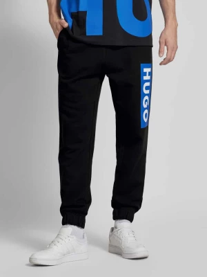 Spodnie dresowe o kroju regular fit z nadrukiem z logo model ‘Nuram’ Hugo Blue