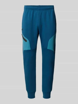 Spodnie dresowe o kroju regular fit z nadrukiem z logo Model 'Unstoppable' Under Armour