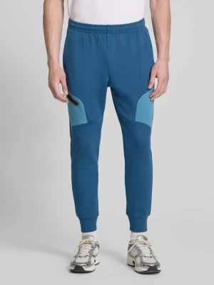 Spodnie dresowe o kroju regular fit z nadrukiem z logo Model 'Unstoppable' Under Armour