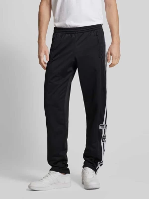 Spodnie dresowe o kroju regular fit z naszywkami z logo model ‘ADIBREAK’ adidas Originals