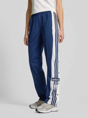 Spodnie dresowe o kroju regular fit z wpuszczanymi kieszeniami model ‘ADIBREAK’ adidas Originals