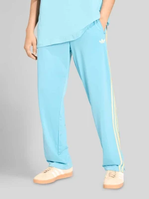 Spodnie dresowe o kroju relaxed fit model 'FIREBIRD' adidas Originals