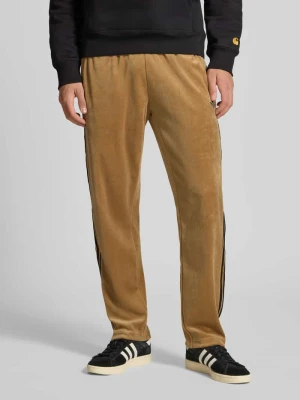 Spodnie dresowe o kroju relaxed fit z elastycznym pasem adidas Originals