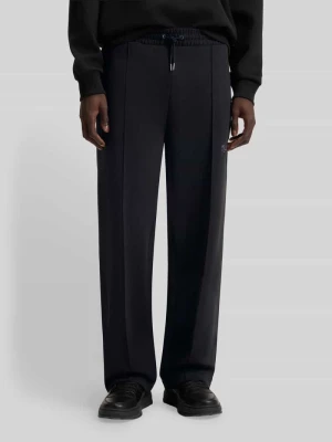 Spodnie dresowe o kroju relaxed fit z mieszanki bawełny model ‘DASINOLO’ HUGO