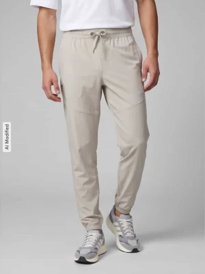 Spodnie dresowe o kroju relaxed fit z nadrukiem z logo Under Armour Khaki
