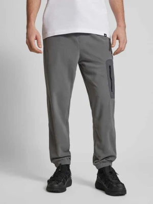 Spodnie dresowe o kroju relaxed fit z naszywką z logo adidas Sportswear