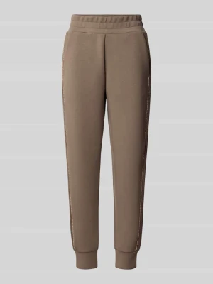 Spodnie dresowe o kroju slim fit z dodatkiem wiskozy model 'Victoire' Guess