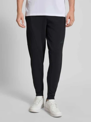 Spodnie dresowe o kroju slim fit z elastycznym pasem Adidas Training