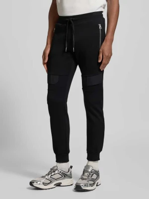 Spodnie dresowe o kroju slim fit z kieszeniami z tyłu Antony Morato