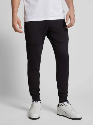 Spodnie dresowe o kroju slim fit z kieszeniami zapinanymi na zamek błyskawiczny model ‘WILL’ jack & jones