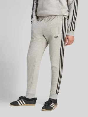 Spodnie dresowe o kroju slim fit z mieszanki bawełny adidas Originals Średnioszary melanż