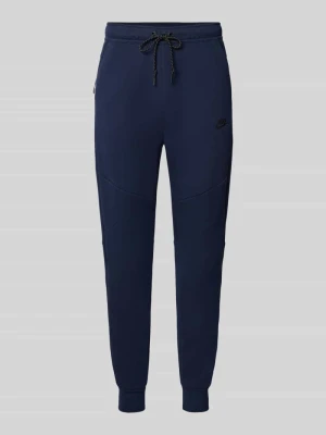 Spodnie dresowe o kroju slim fit z mieszanki bawełny Nike Ciemnoniebieski