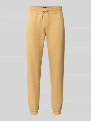 Spodnie dresowe o kroju slim fit z mieszanki bawełny Tommy Jeans Beżowy