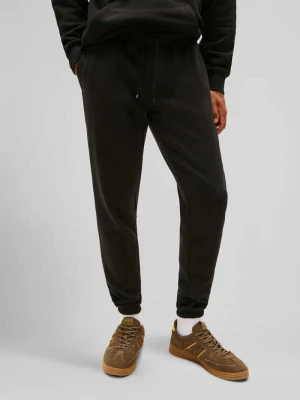 Spodnie dresowe o kroju slim fit z mieszanki bawełny Tommy Jeans Czarny