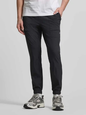 Spodnie dresowe o kroju slim fit z nadrukiem z logo Fabletics