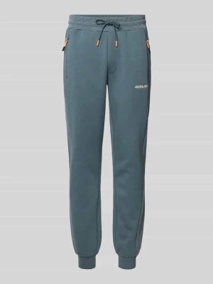 Spodnie dresowe o kroju slim fit z nadrukiem z logo model ‘Gordon’ jack & jones