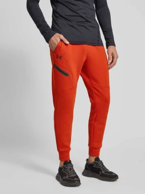 Spodnie dresowe o kroju slim fit z nadrukiem z logo model ‘Unstoppable’ Under Armour
