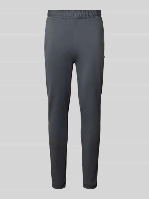 Spodnie dresowe o kroju slim fit z naszywką z logo Lacoste Ciemnoszary