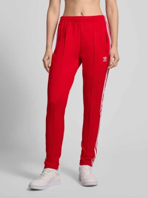 Spodnie dresowe o kroju slim fit z przyszytymi kantami adidas Originals