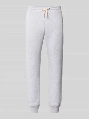 Spodnie dresowe o kroju slim fit z tunelem REVIEW Jasnoszary melanż
