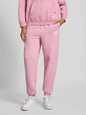 Spodnie dresowe o kroju slim fit z wyhaftowanym logo Puma Różowy