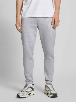 Zdjęcie produktu Spodnie dresowe o kroju slim fit z zaznaczonym rozporkiem Tommy Jeans