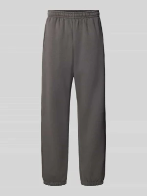 Spodnie dresowe o kroju straight fit z mieszanki bawełny z wpuszczanymi kieszeniami Urban Classics Antracytowy