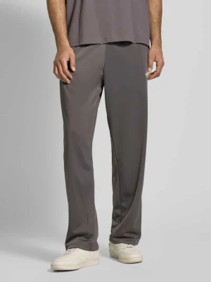 Spodnie dresowe o kroju straight fit z wyhaftowanym logo model ‘Firebird’ adidas Originals