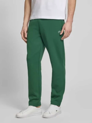 Spodnie dresowe o kroju tapered z dodatkiem bawełny Lacoste Sport