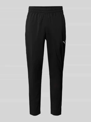 Spodnie dresowe o kroju tapered z elastycznym pasem model 'TAD ESSENTIALS' Puma Czarny