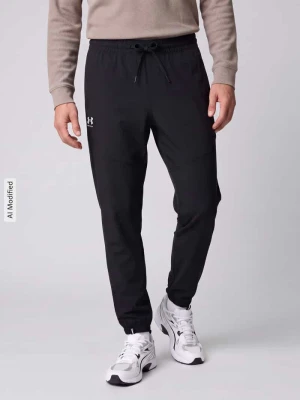 Spodnie dresowe o kroju tapered z nadrukiem logo model 'Vibe' Under Armour Czarny