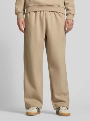 Spodnie dresowe o kroju wide fit z elastycznym pasem adidas Originals