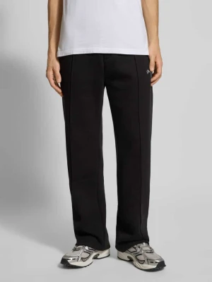 Spodnie dresowe o luźnym kroju z wyhaftowanym logo i elastycznym pasem PROHIBITED