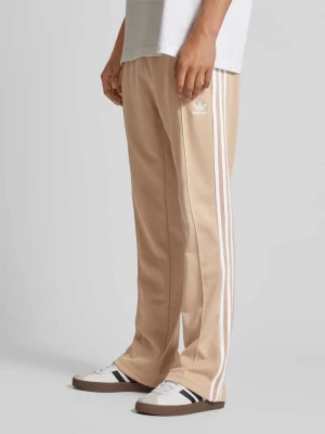 Spodnie dresowe o rozkloszowanym kroju z elastycznym pasem adidas Originals